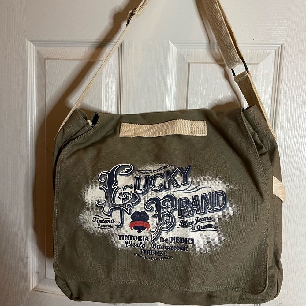 Lucky Brand large canvas olive green messenger bag with adjustable beige strap.